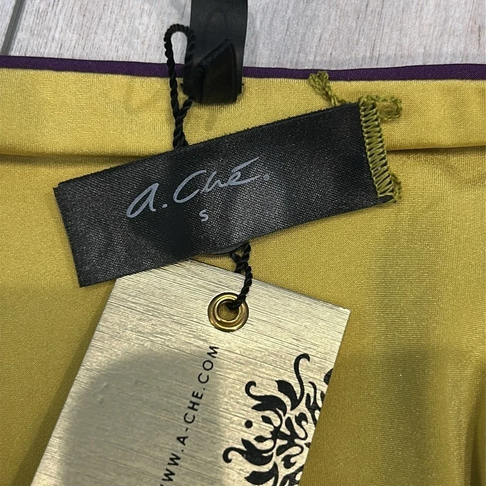 A. Che reversible swim bikini bottom Purple yellow size small
